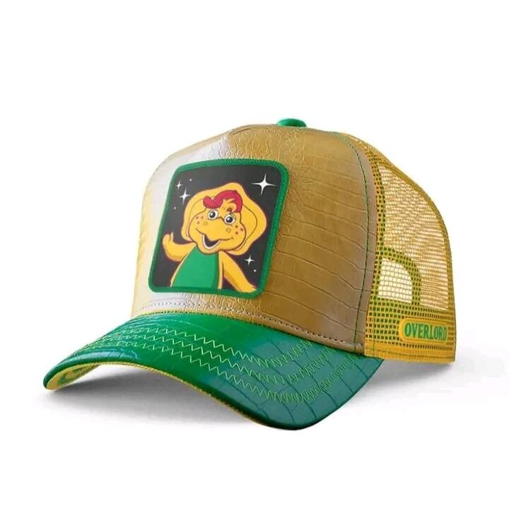 OVERLORD. A yellow dinosaur-like character with red hair and stars around it.