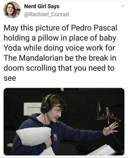 _i Nerd Girl Says May this picture of Pedro Pascal holding a pillow in place of baby Yoda while doing voice work for The Mandalorian be the break in doom scrolling that you need to see
