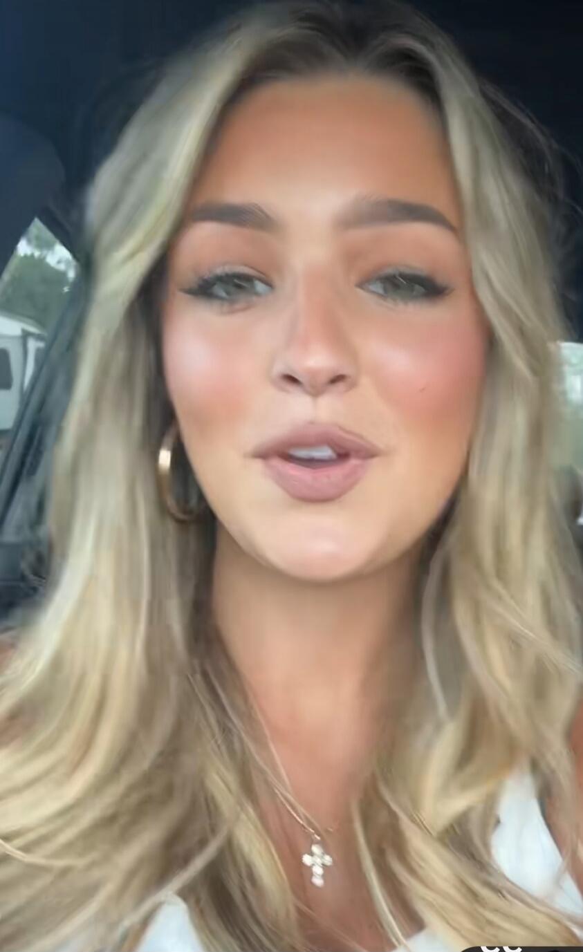 A woman is speaking to the camera. The specific content of her speech is unknown without audio.