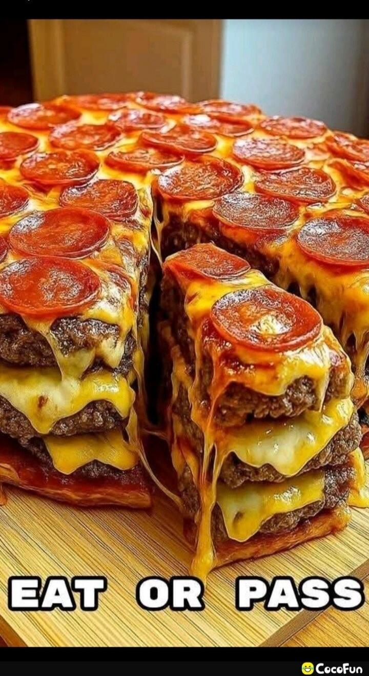 EAT OR PASS. A giant pizza-shaped dish made of multiple layers of cheeseburger patties, topped with melted cheese and pepperoni slices. A slice has been cut out, showing the stacked layers.