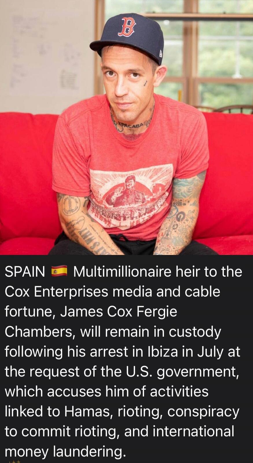SPAIN 🇪🇸 Multimillionaire heir to the Cox Enterprises media and cable fortune, James Cox Fergie Chambers, will remain in custody following his arrest in Ibiza in July at the request of the U.S. government, which accuses him of activities linked to Hamas, rioting, conspiracy to commit rioting, and international money laundering. Tattoos visible: 'КР