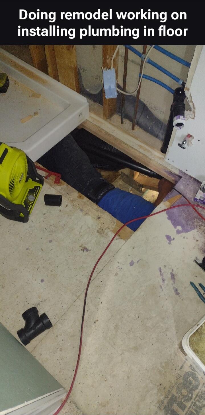 Doing remodel working on installing plumbing in floor