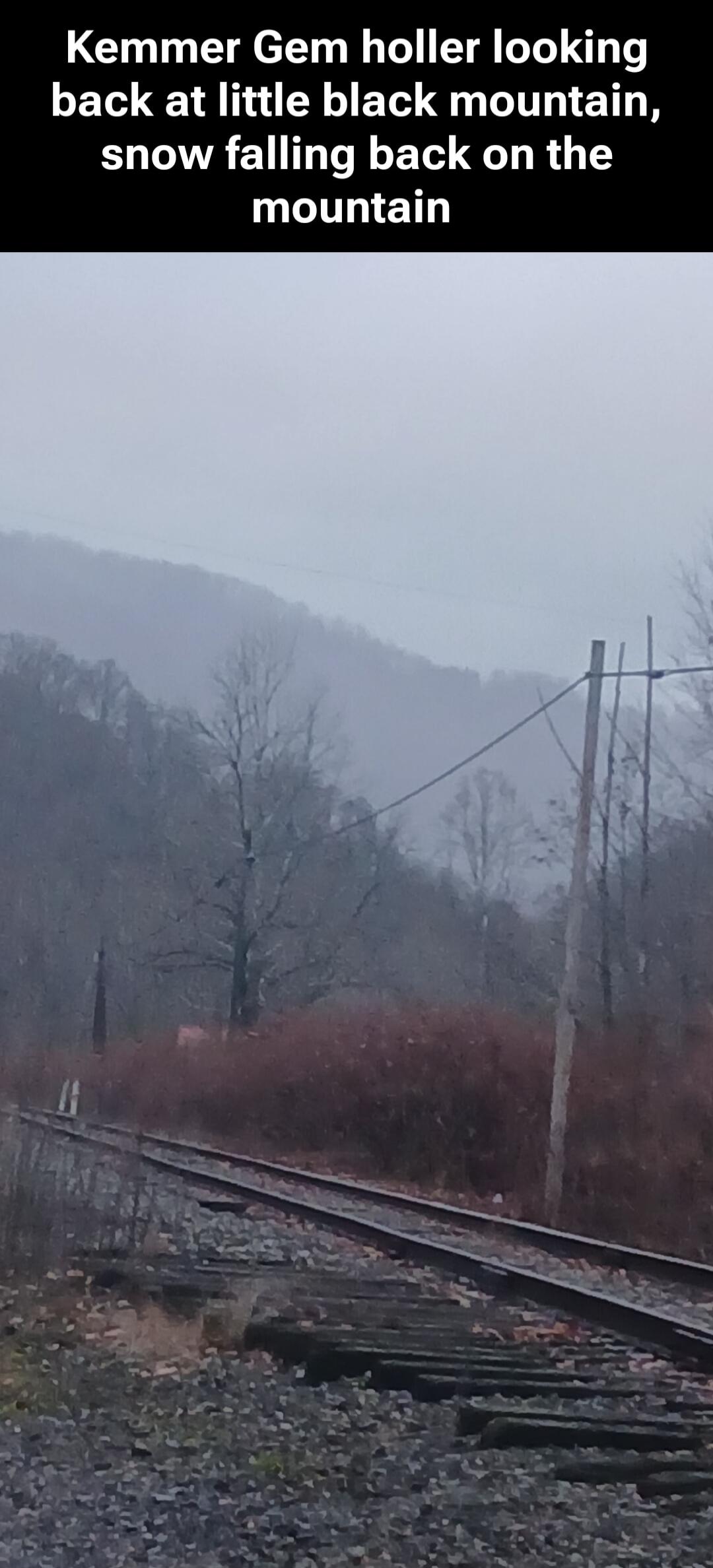 Kemmer Gem holler looking back at little black mountain, snow falling back on the mountain\nSession ID: 1028733.