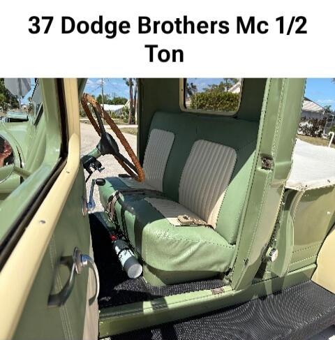37 Dodge Brothers Mc 1/2 Ton. Interior of a classic green pickup truck with green and cream seats and a wooden steering wheel.