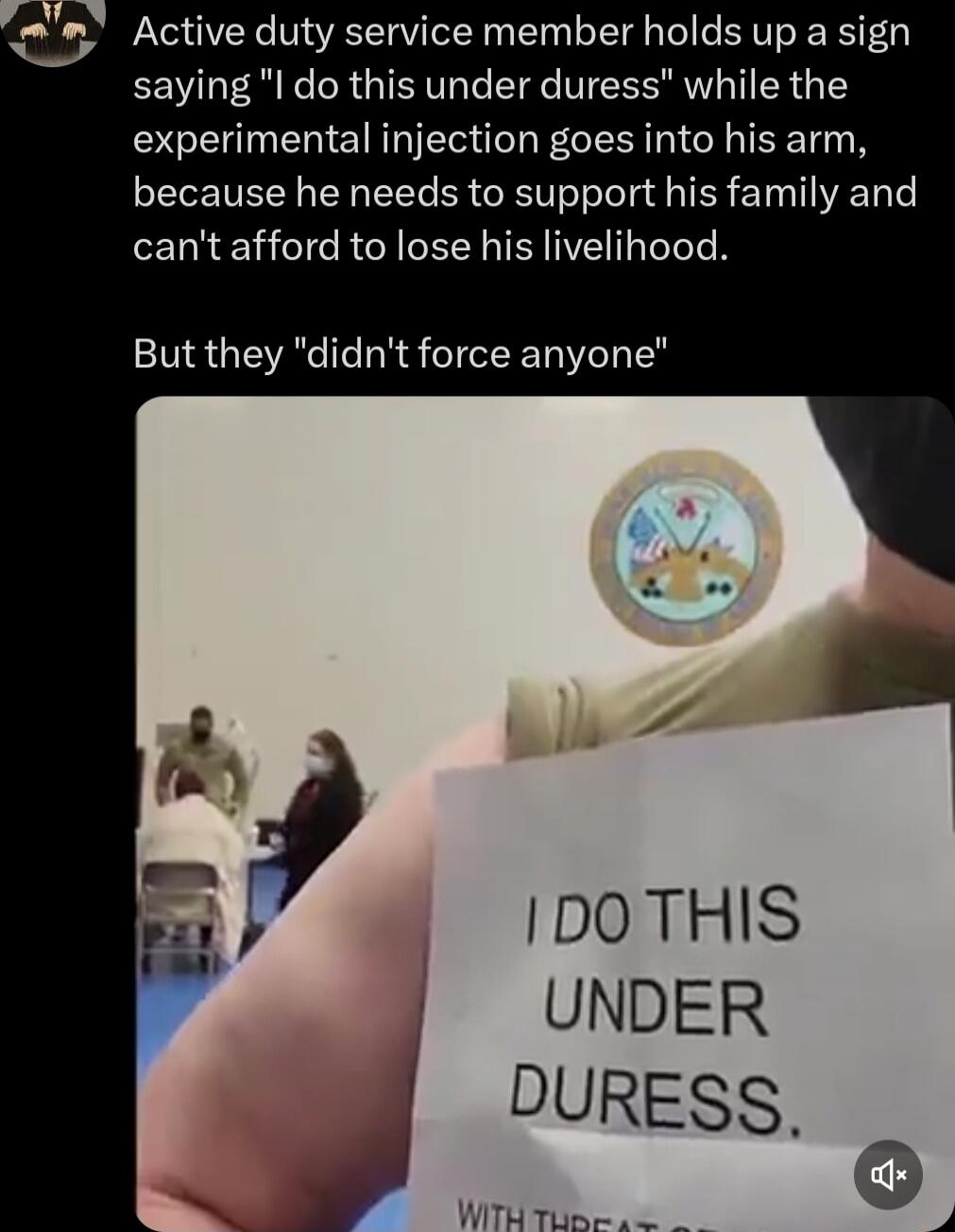 Active duty service member holds up a sign saying 