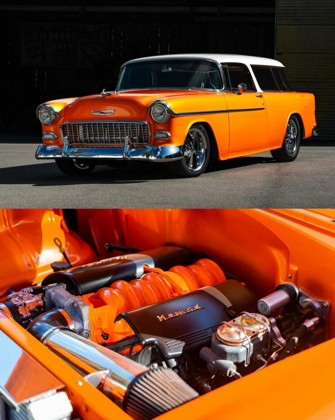 A bright orange classic car with a white roof, chrome bumper, and exposed engine bay featuring orange-painted components.
