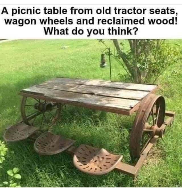 A picnic table from old tractor seats wagon wheels and reclaimed wood What do you think