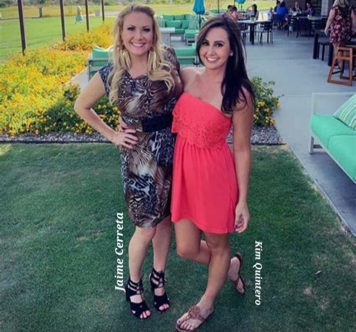 Two women posing on a lawn at an outdoor venue. One wears a patterned short dress and heels; the other wears a coral pink strapless dress and sandals. There appears to be signage or labels on the image near each woman, but identifying names are omitted.