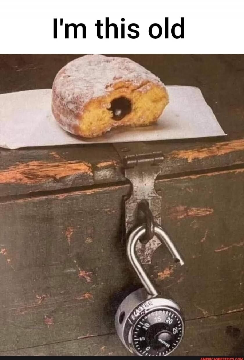 I'm this old. The image shows a partially eaten donut with a bite taken out, placed on a wooden chest with an open combination lock. This is a meme referencing a common trick used by kids to remember or indicate the first number of a combination lock by making the lock look like a donut with a bite.
