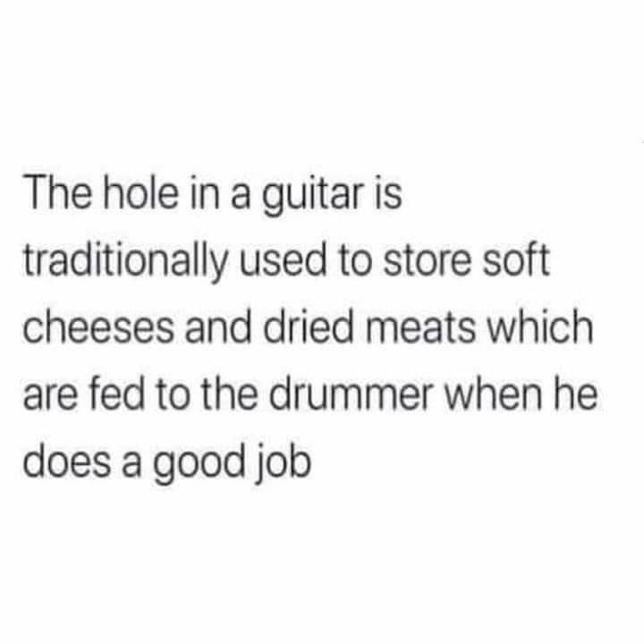 The hole in a guitar is traditionally used to store soft cheeses and dried meats which are fed to the drummer when he does a good job