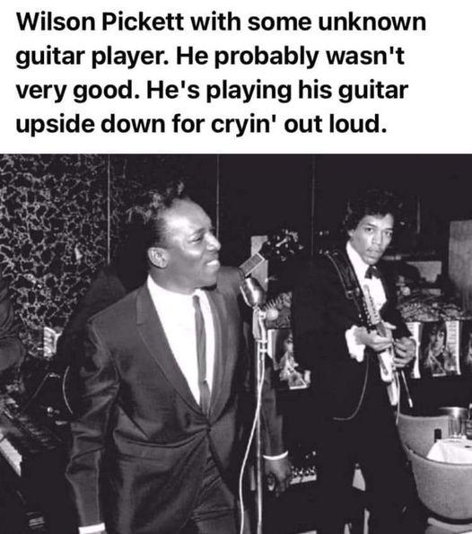 Wilson Pickett with some unknown guitar player He probably wasnt very good Hes playing his guitar upside down for cryin out loud