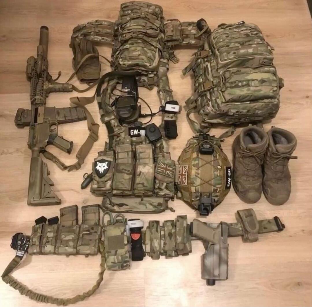 A full set of tactical gear including an assault rifle, plate carrier, helmet, backpack, combat boots, and a tactical belt with a pistol. Text visible: GW-, GW-06.