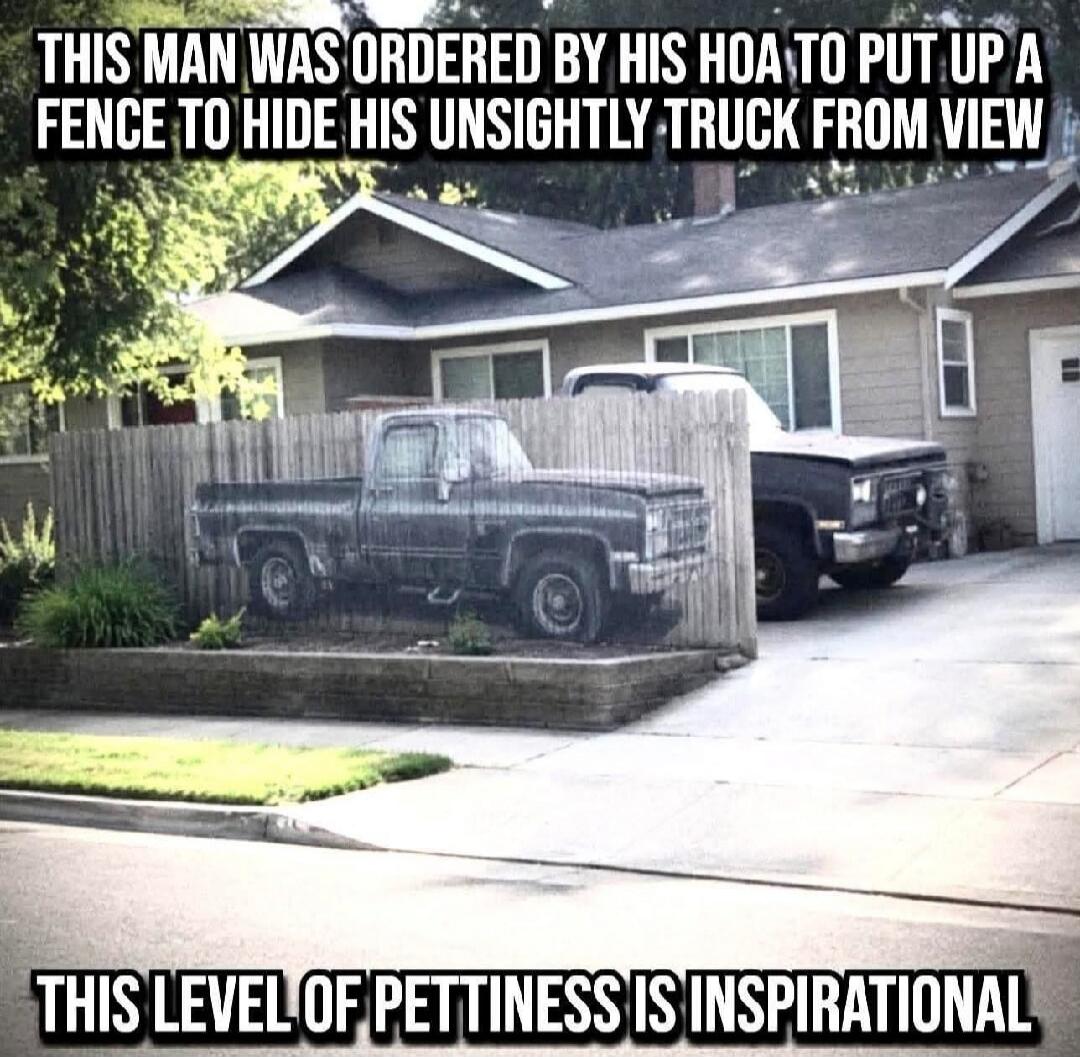THIS MAN WAS ORDERED BY HIS HOA TO PUT UP A FENCE TO HIDE HIS UNSIGHTLY TRUCK FROM VIEW THIS LEVEL OF PETTINESS IS INSPIRATIONAL