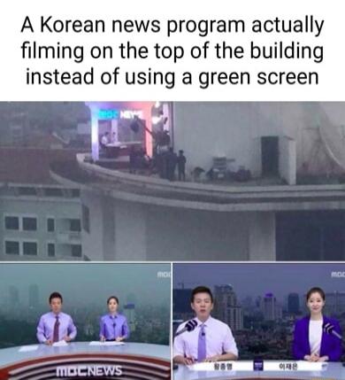 A Korean news program actually filming on the top of the building instead of using a green screen