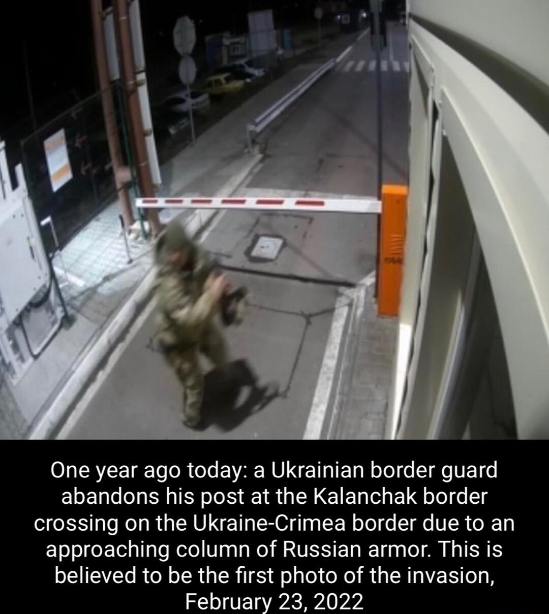 One year ago today a Ukrainian border guard abandons his post at the Kalanchak border crossing on the Ukraine Crimea border due to an approaching column of Russian armor This is believed to be the first photo of the invasion February 23 2022