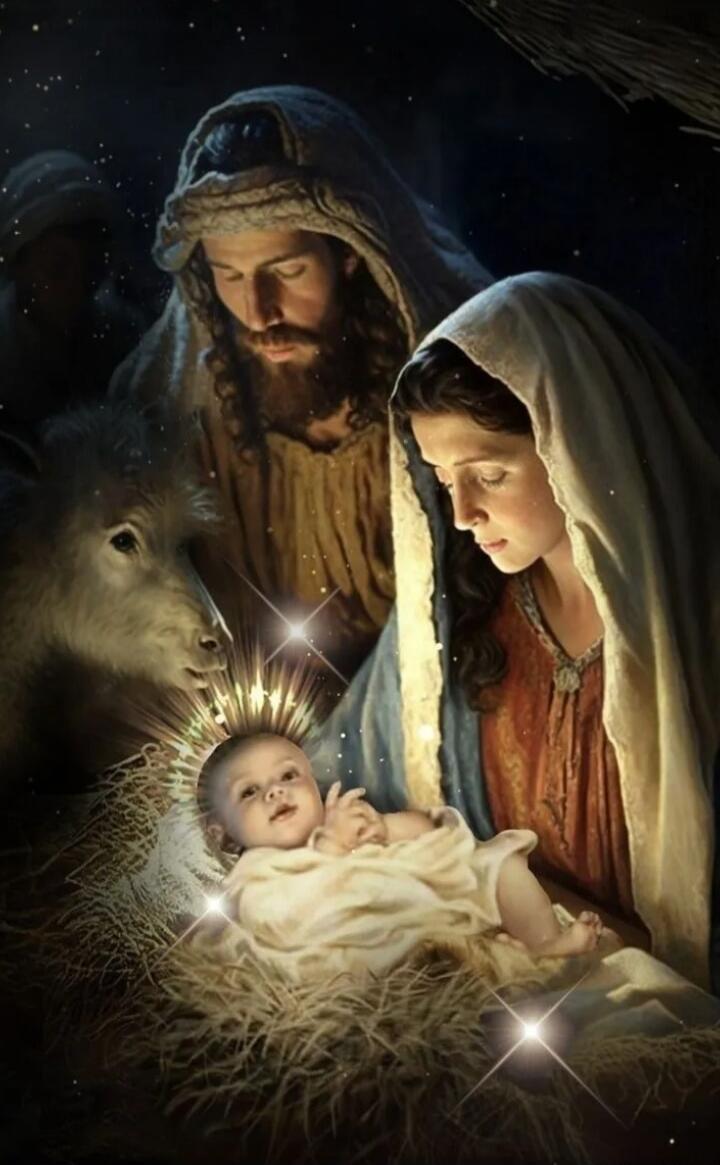 Nativity scene with baby Jesus, Mary, Joseph, and a lamb.