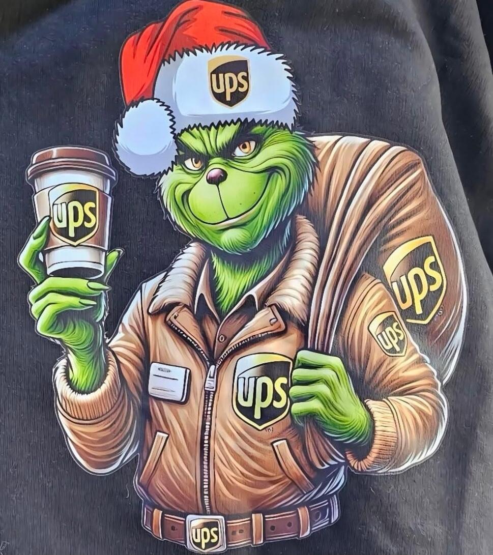 Grinch-like character in a UPS uniform holding a coffee cup with UPS logos, wearing a Santa hat. Promotional/parody image.