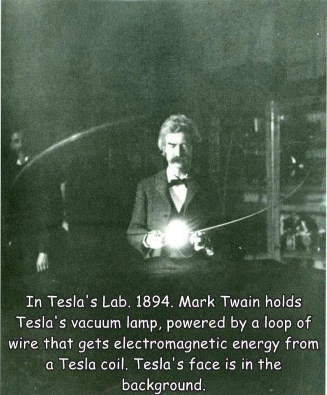 3 oA B In Teslas Lab 1894 Mark Twain holds Teslas vacuum lamp powered by a loop of wire that gets electromagnetic energy from a Tesla coil Teslas face is in the background