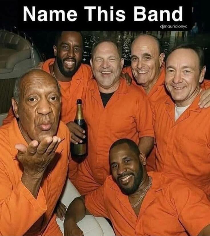 Name This Band. The image shows several famous men, including Bill Cosby, Harvey Weinstein, Rudy Giuliani, Kevin Spacey, and R. Kelly, all wearing orange jumpsuits, which are typically associated with prisoners. They are smiling and posing together, with one holding a bottle of champagne. The meme's caption asks viewers to 'Name This Band,' implyin
