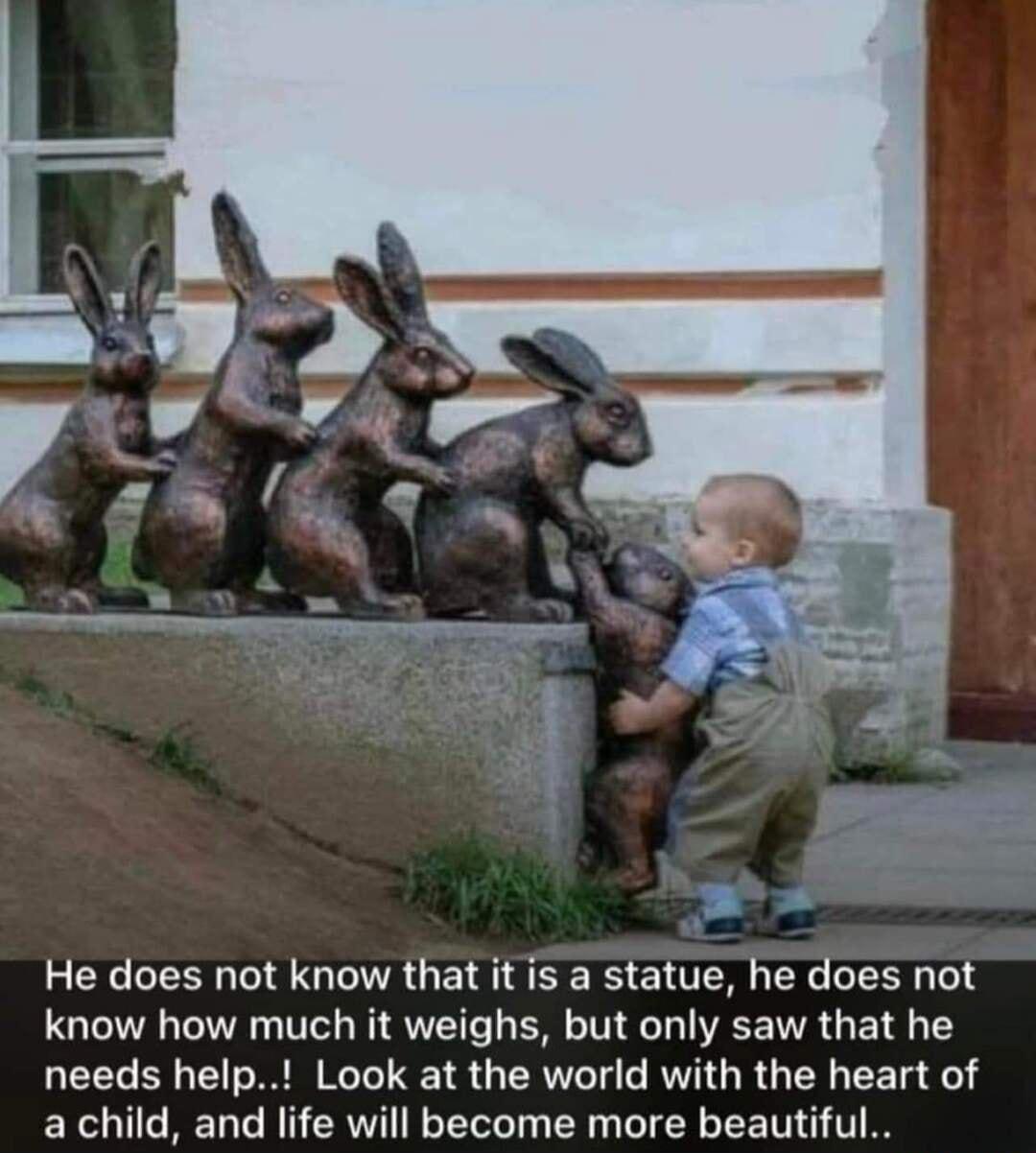 He does not know that it is a statue he does not know how much it weighs but only saw that he needs help Look at the world with the heart of a child and life will become more beautiful