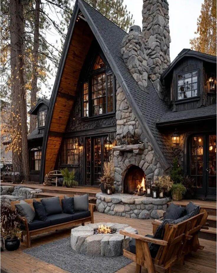 Cozy cabin with a fireplace and outdoor seating area.