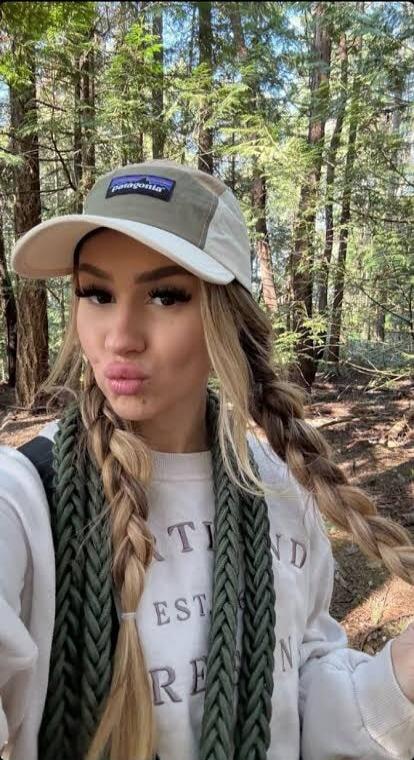 Patagonia (on cap), partial text on sweatshirt: 'TI EST RE'