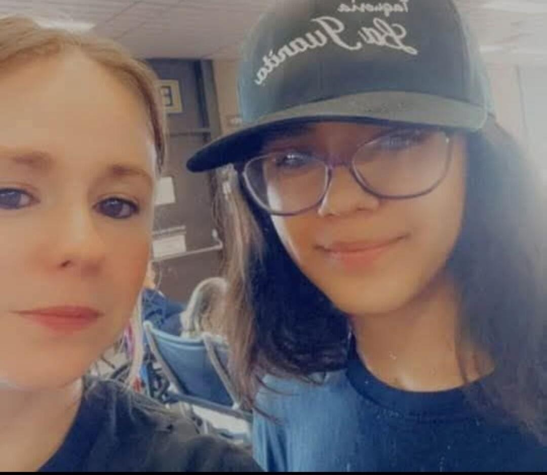 Two women posing for a casual photo.