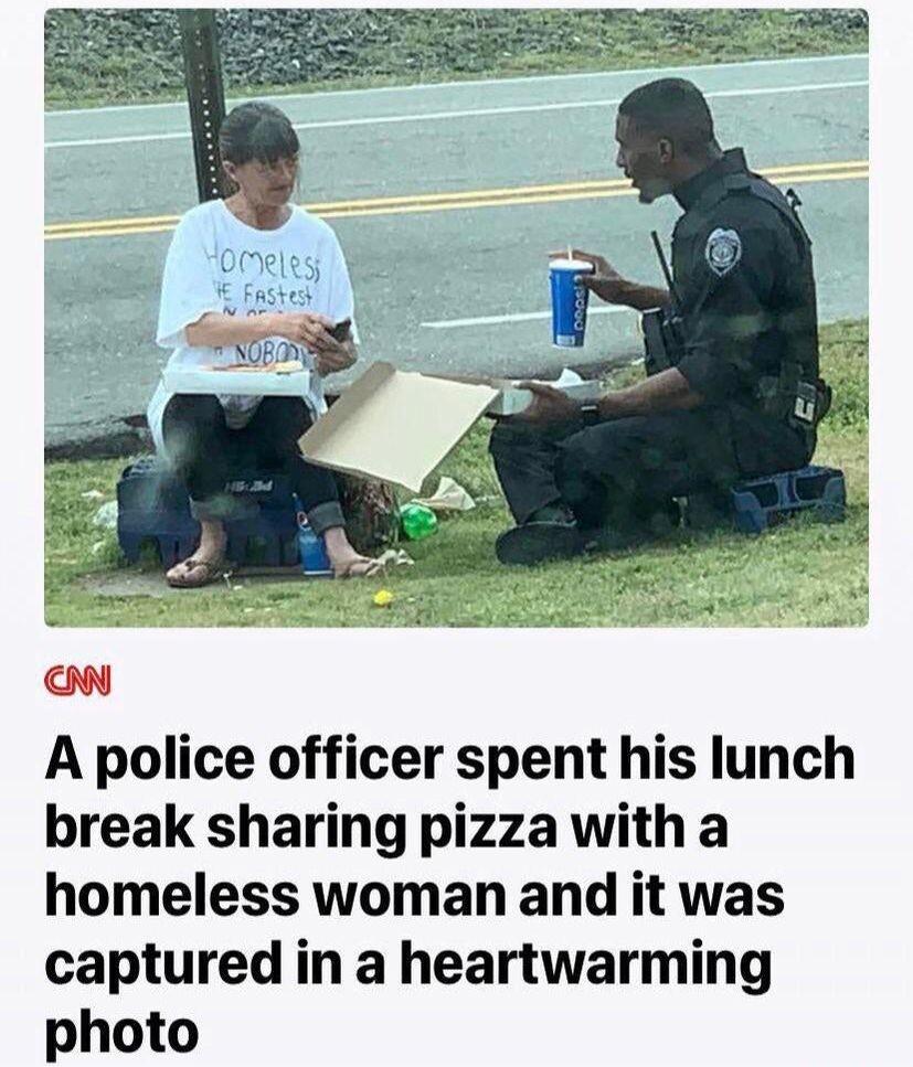 A police officer spent his lunch break sharing pizza with a homeless woman and it was captured in a heartwarming photo