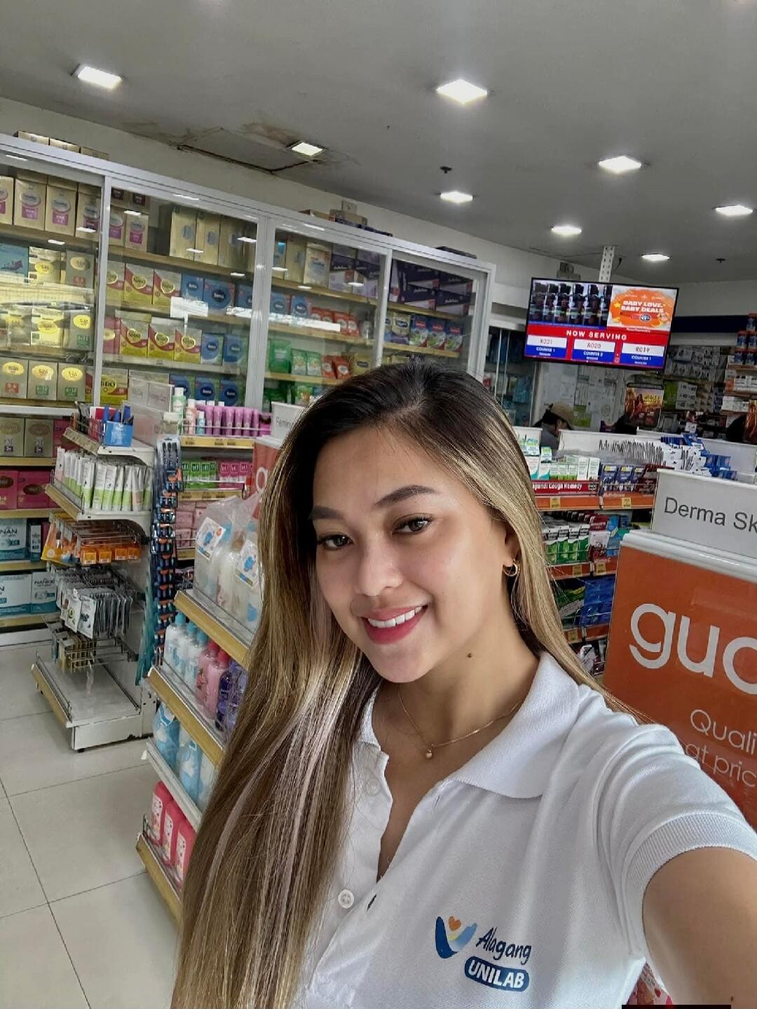 A woman in a white polo shirt with 