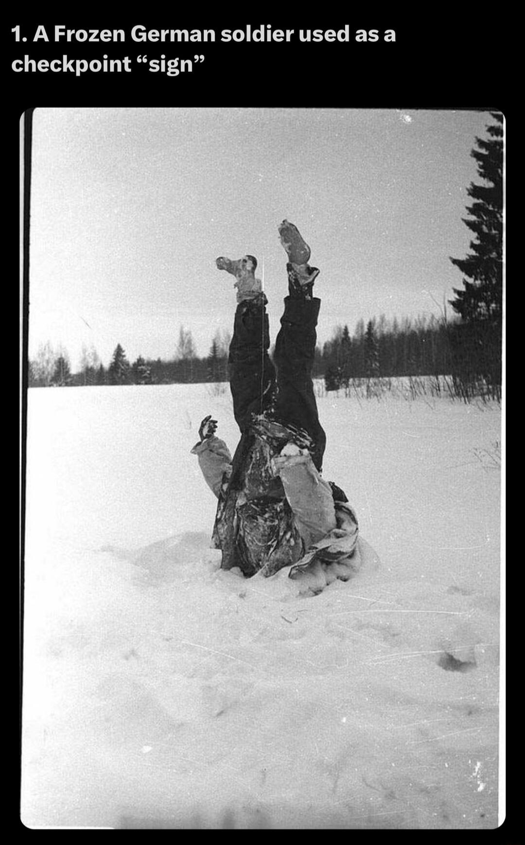 1 AFrozen German soldier used asa checkpoint sign