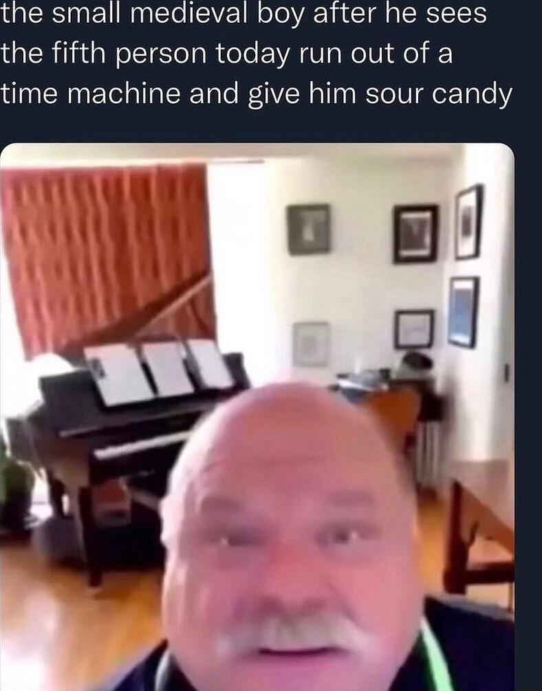 the small medieval boy after he sees the fifth person today run out of a time machine and give him sour candy
