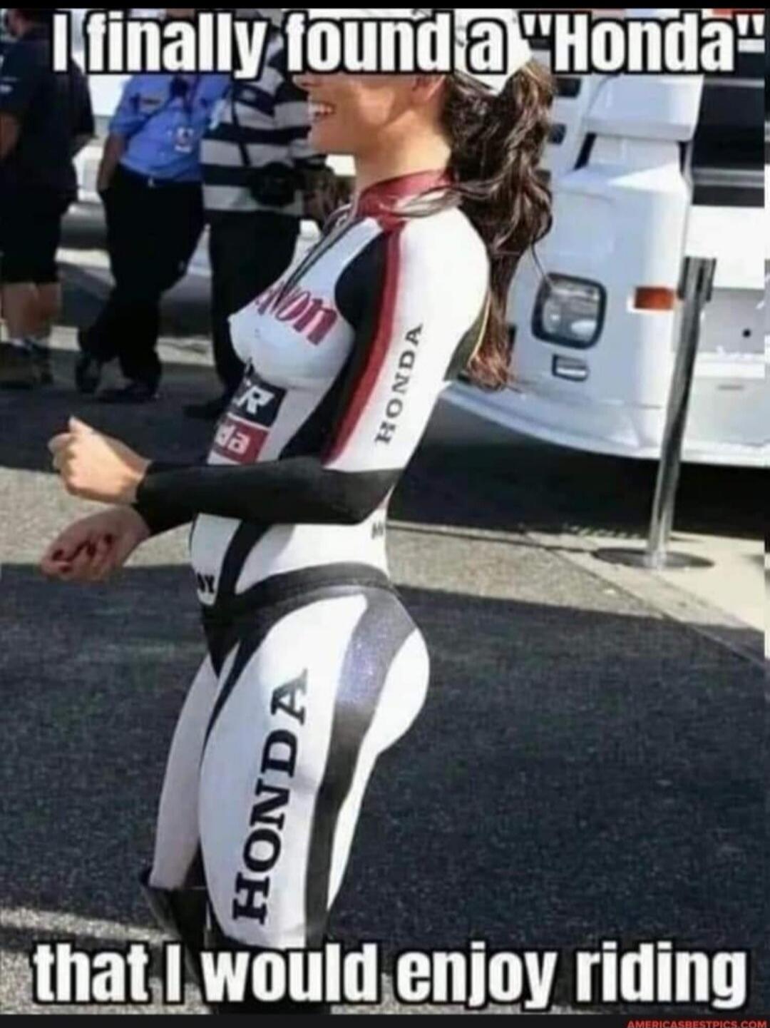 I finally found a 'Honda' that I would enjoy riding. A woman in a tight, body-painted suit with 'HONDA' branding is smiling at an event.