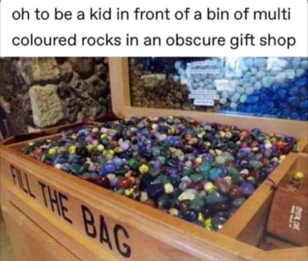 oh to be a kid in front of a bin of multi coloured rocks in an obscure gift shop