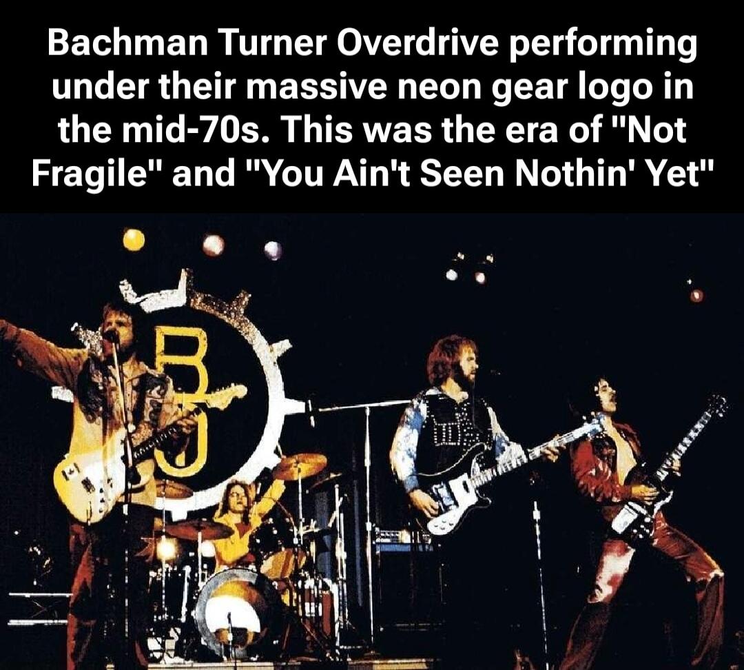 Bachman Turner Overdrive performing under their massive neon gear logo in the mid-70s. This was the era of 