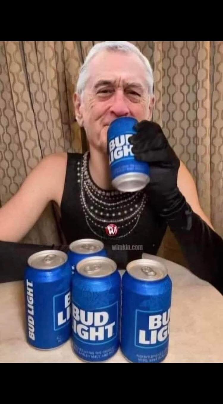 BUD LIGHT, BUD LIGHT, BUD LIGHT, BUD LIGHT, BUD LIGHT, wimkin.com. The image shows Robert De Niro's face photoshopped onto a person in a black dress and gloves, drinking a Bud Light. Several other Bud Light cans are on the table.