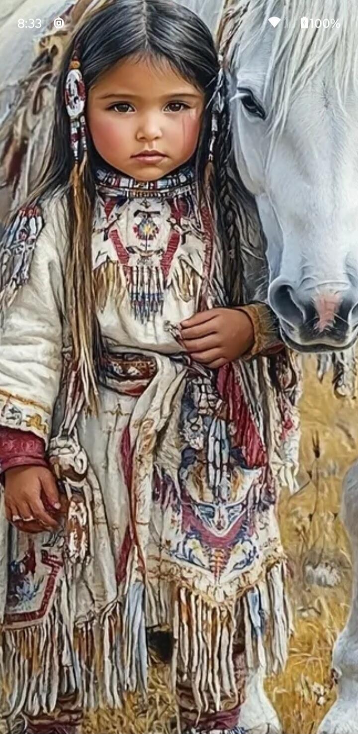 A young child wearing a fringed, bead-decorated traditional dress stands beside a white horse. The screen shows a time readout of 8:33 and a battery indicator at 100%.