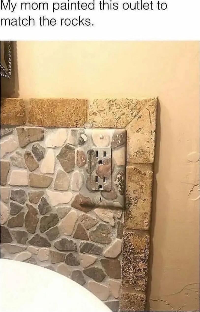 My mom painted this outlet to match the rocks
