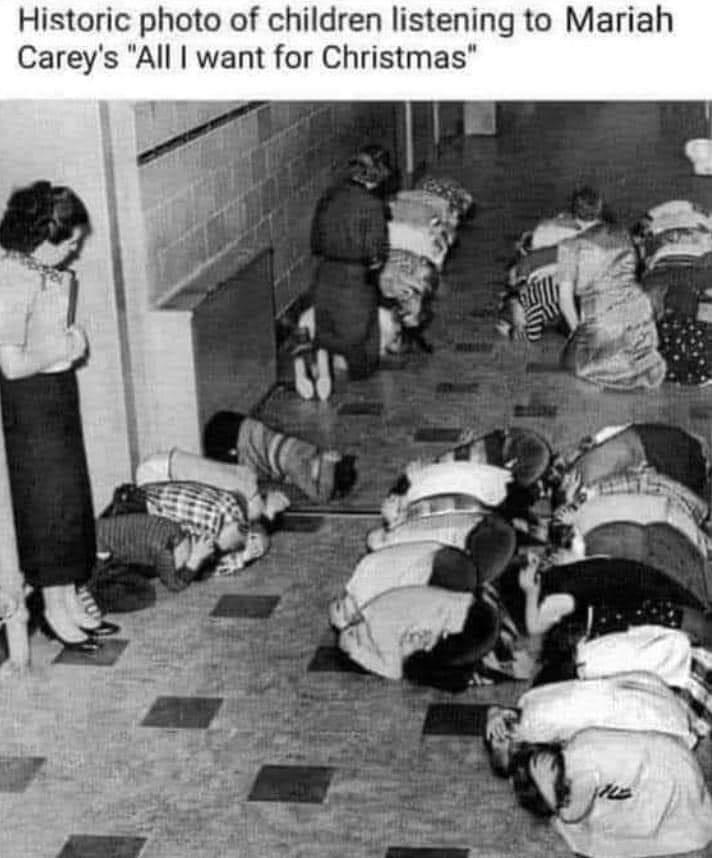 Historic photo of children listening to Mariah Careys All want for Christmas