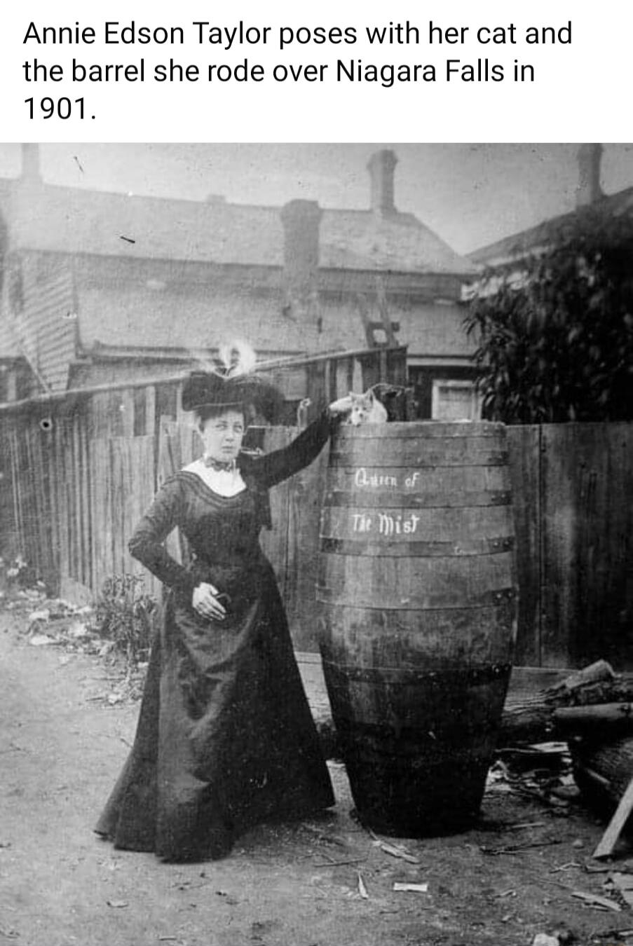 Annie Edson Taylor poses with her cat and the barrel she rode over Niagara Falls in 1901