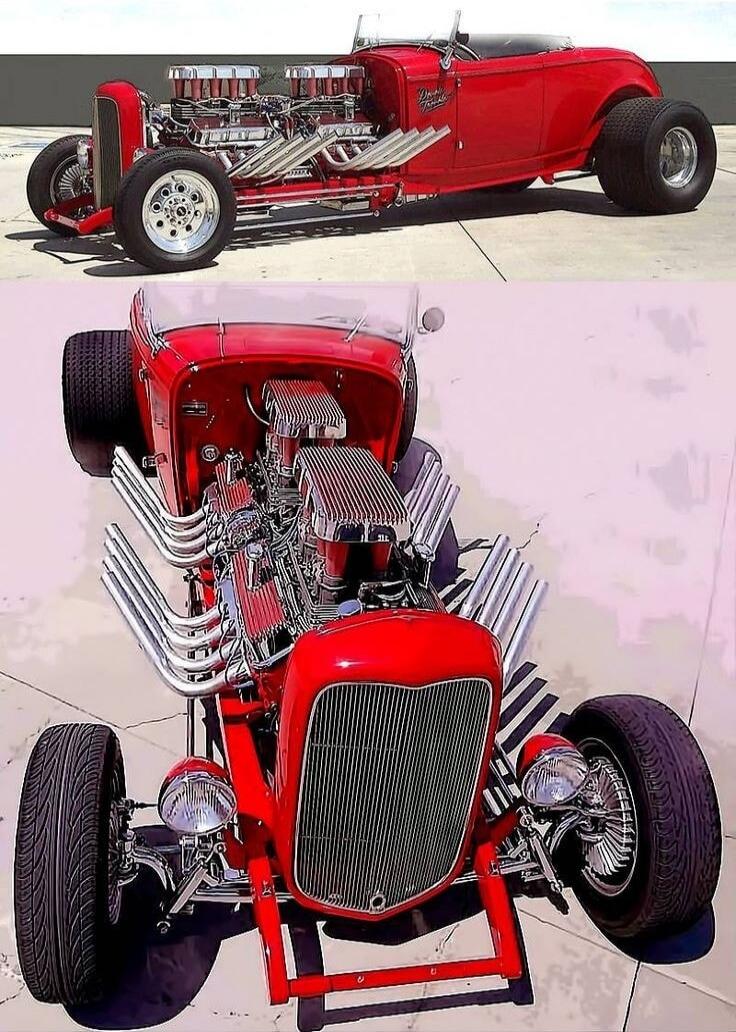 A vibrant red hot rod with a powerful, exposed engine featuring multiple chrome carburetors and side-exit exhaust pipes. The car has a classic roadster design with wide rear tires. The word 'Roadster' is visible on the side.