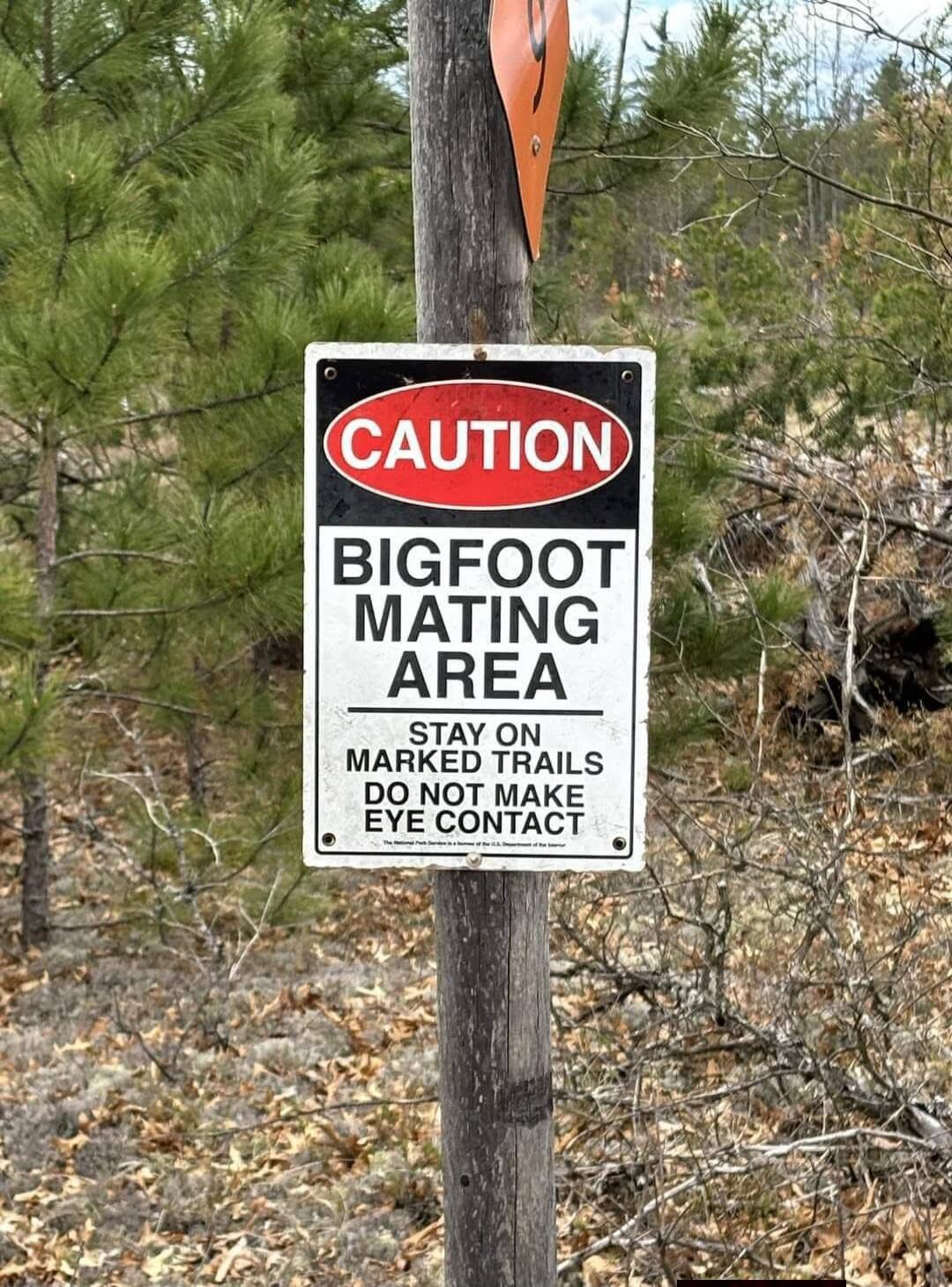 CAUTION BIGFOOT MATING AREA STAY ON MARKED TRAILS DO NOT MAKE EYE CONTACT