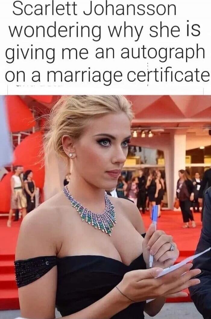 Scarlett Johansson wondering why she is giving me an autograph on a marriage certificate