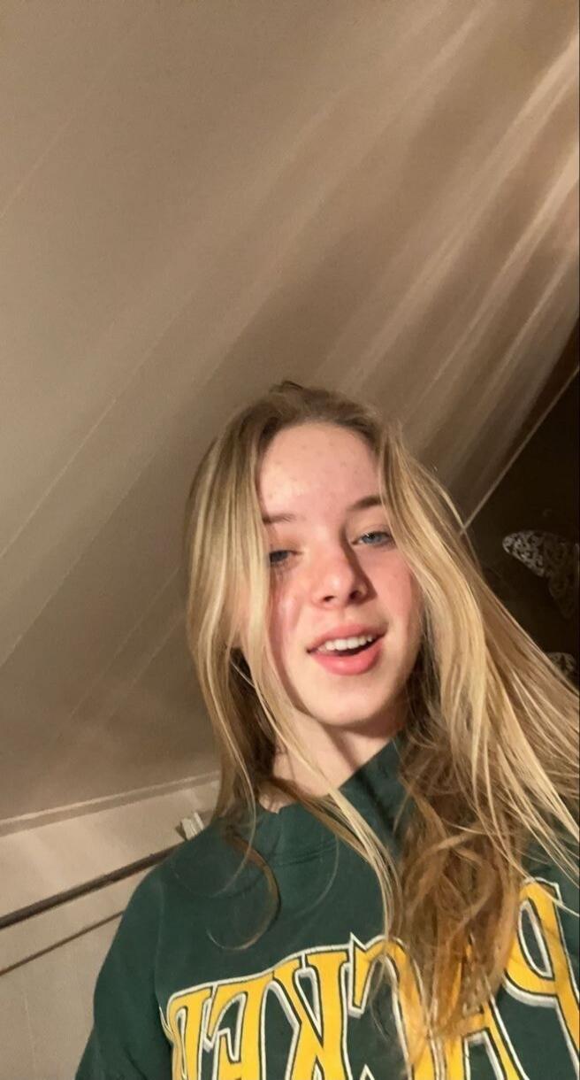 Partial text on shirt: 'PACKERS'