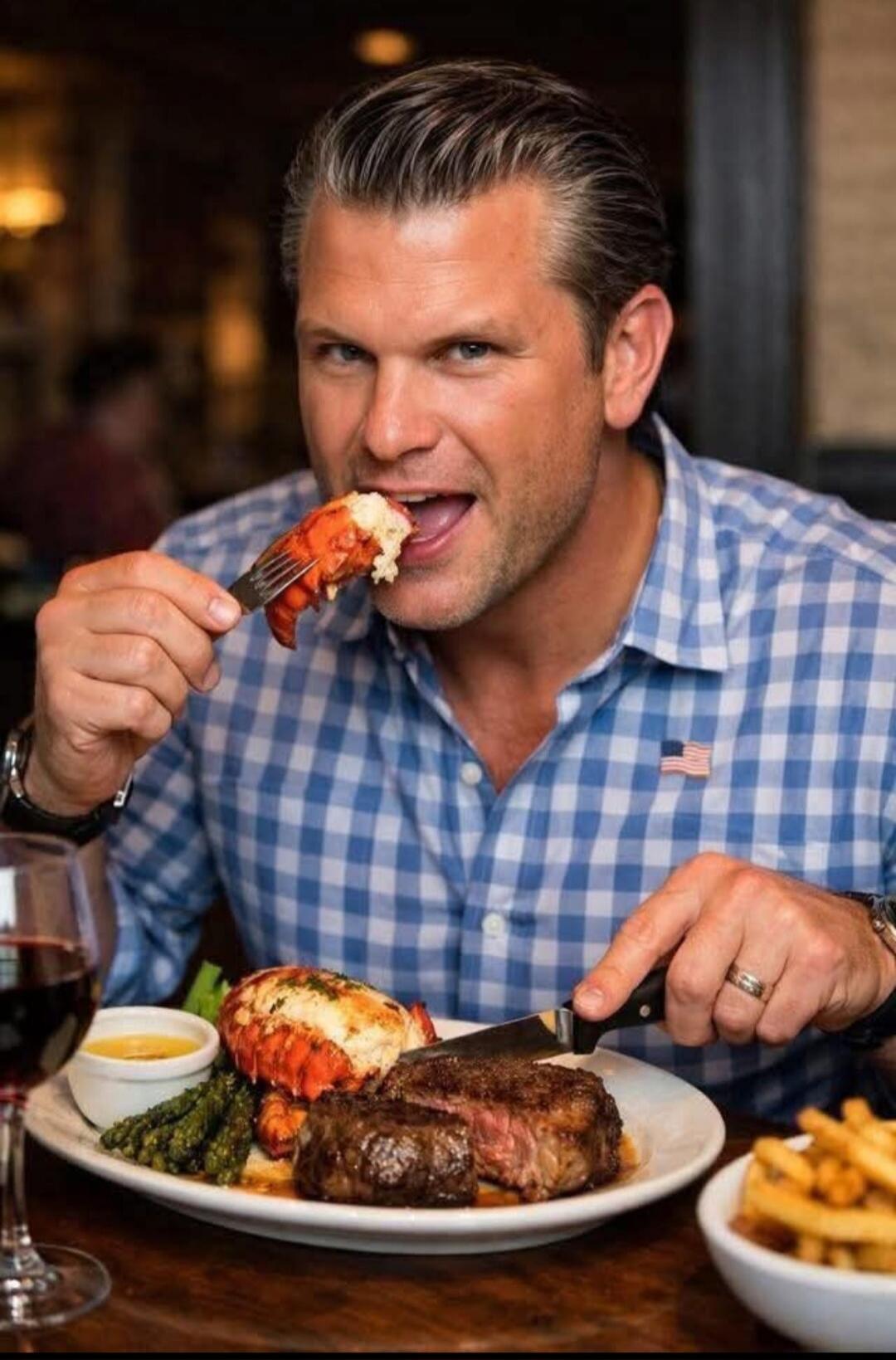 A man is eating a steak and lobster dinner.