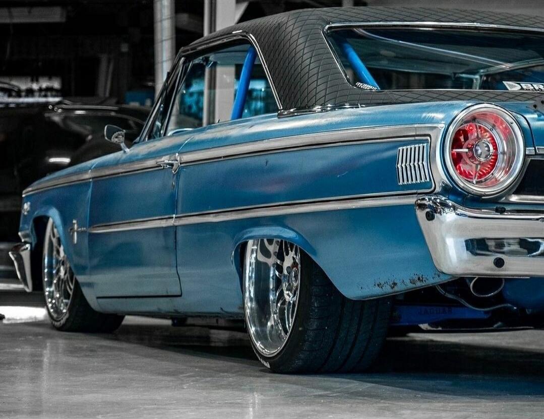 Blue vintage car with chrome detailing.