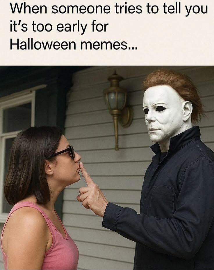 When someone tries to tell you it's too early for Halloween memes... A person in a Michael Myers mask shushes a woman who is wearing sunglasses and a pink tank top.
