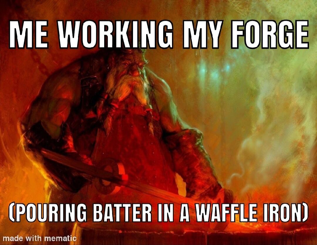 ME WORKING MY EORGE POURING BATTER IN A WAFELE IRON