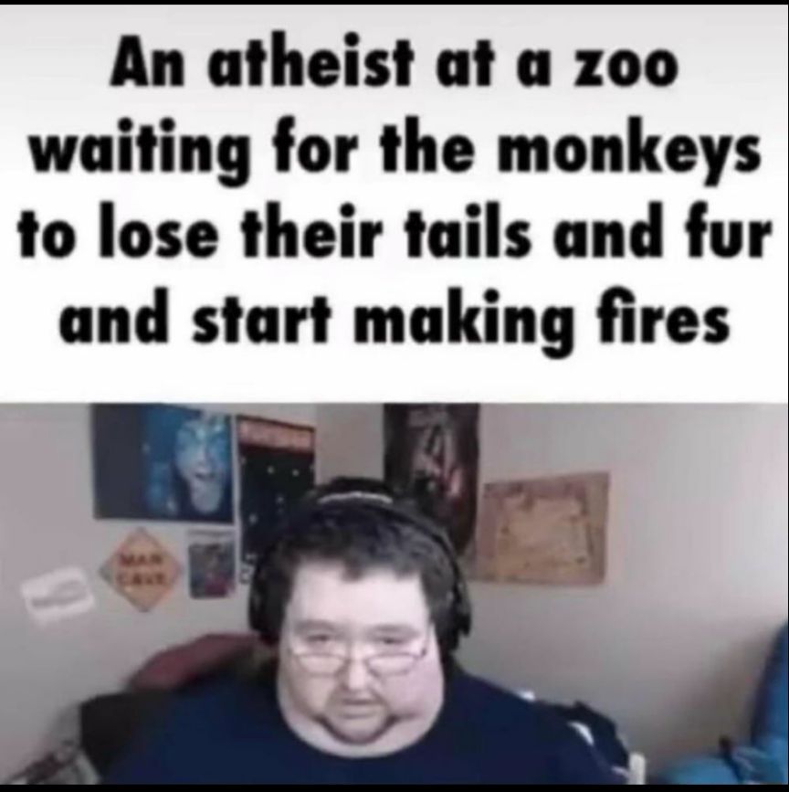 An atheist at a zoo waiting for the monkeys to lose their tails and fur and start making fires