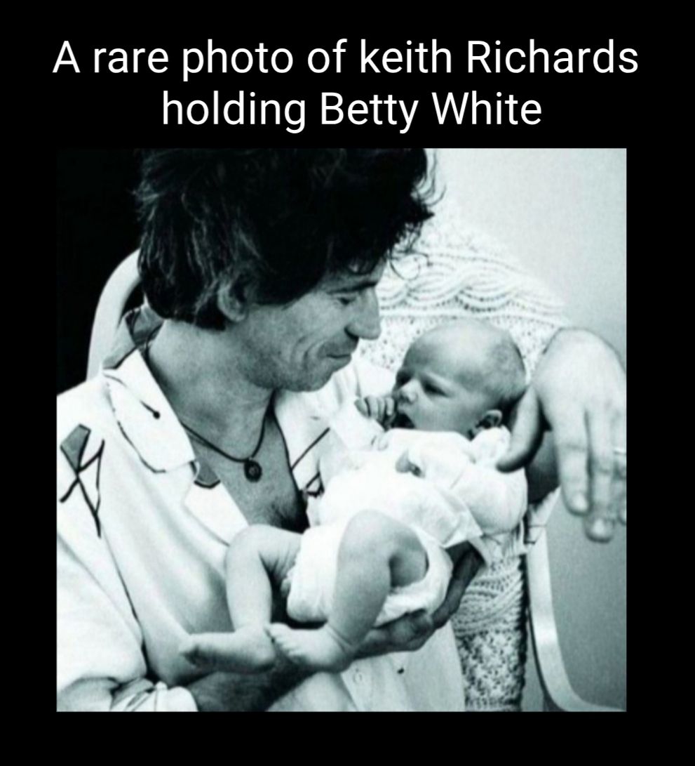 A rare photo of keith Richards holding Betty White