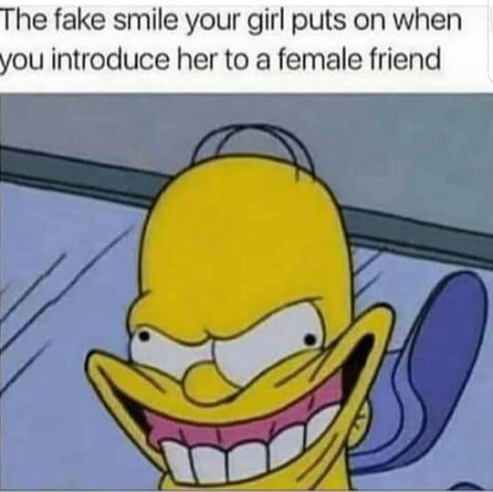 The fake smile your girl puts on when you introduce her to a female friend